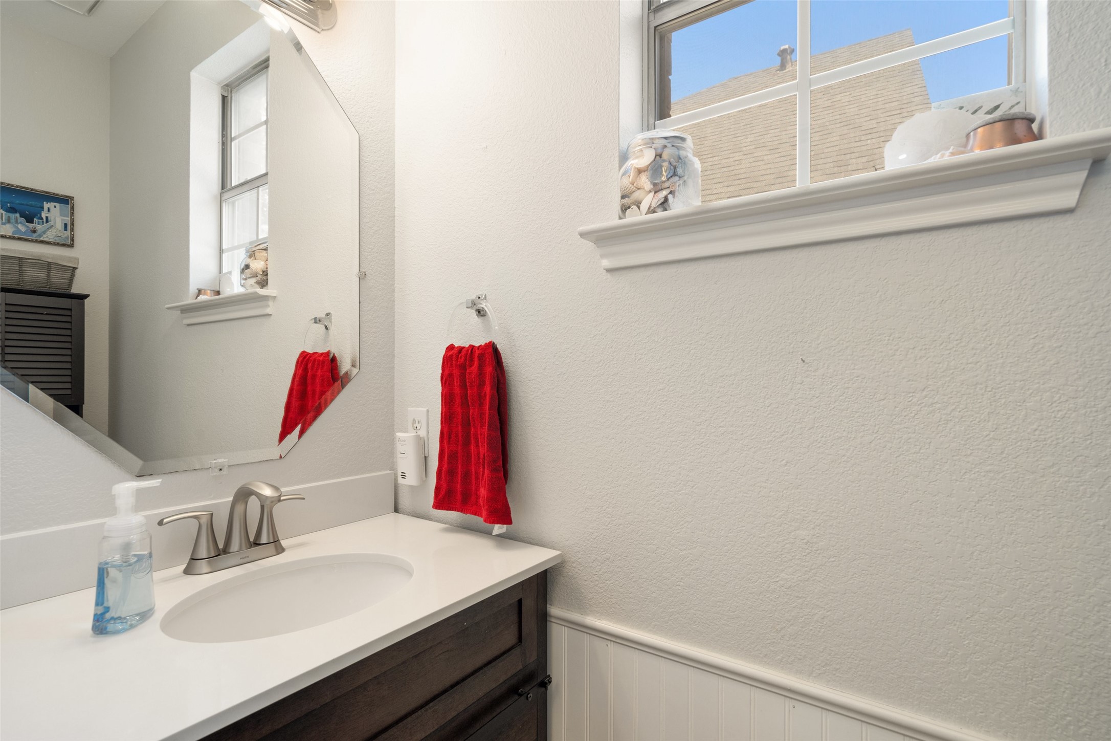 12813 Withers Way Austin, TX 78727 - Photo 17 of 40 a bathroom with a sink vanity and a mirror