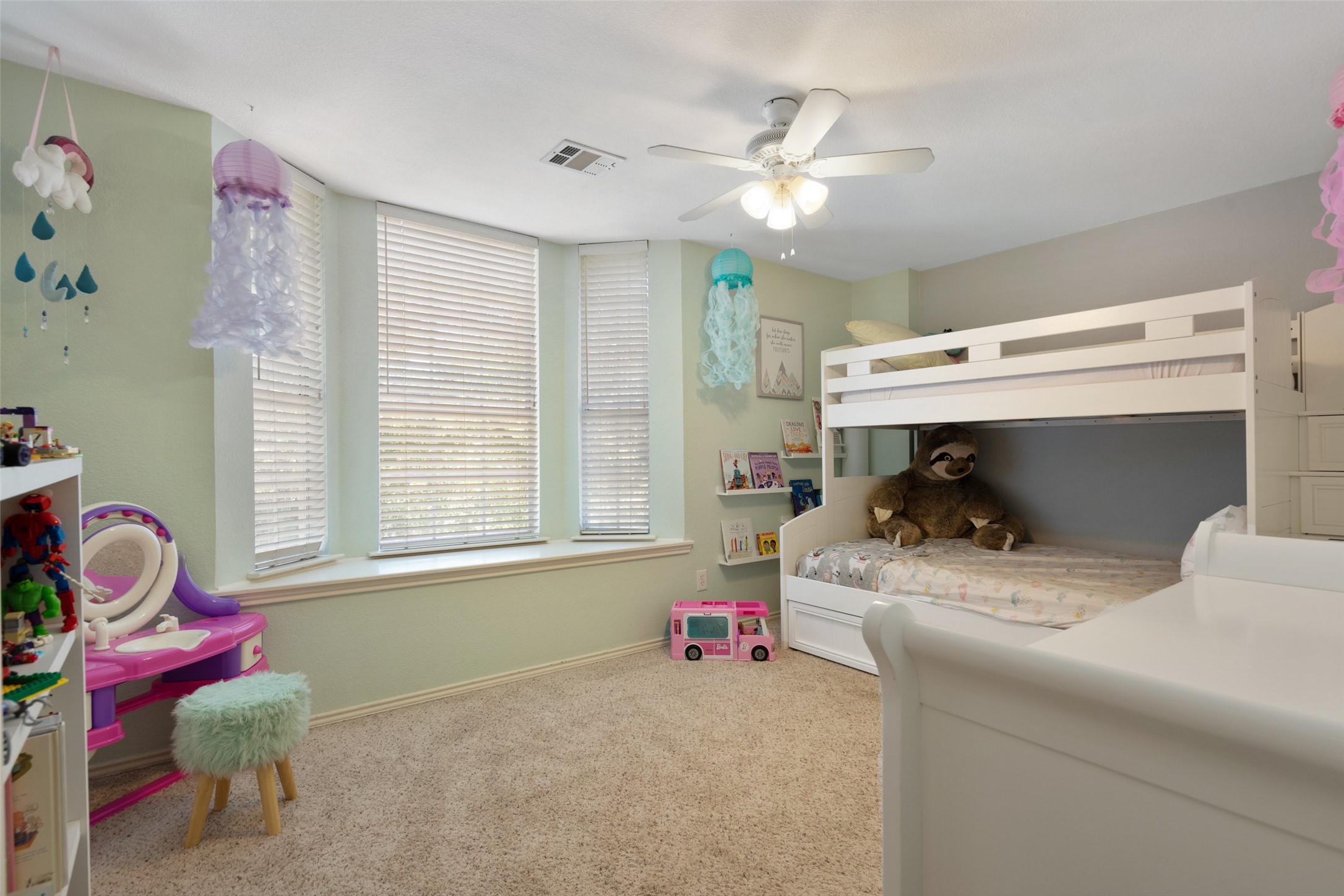 12813 Withers Way Austin, TX 78727 - Photo 26 of 40 a bedroom with a bed and a chandelier