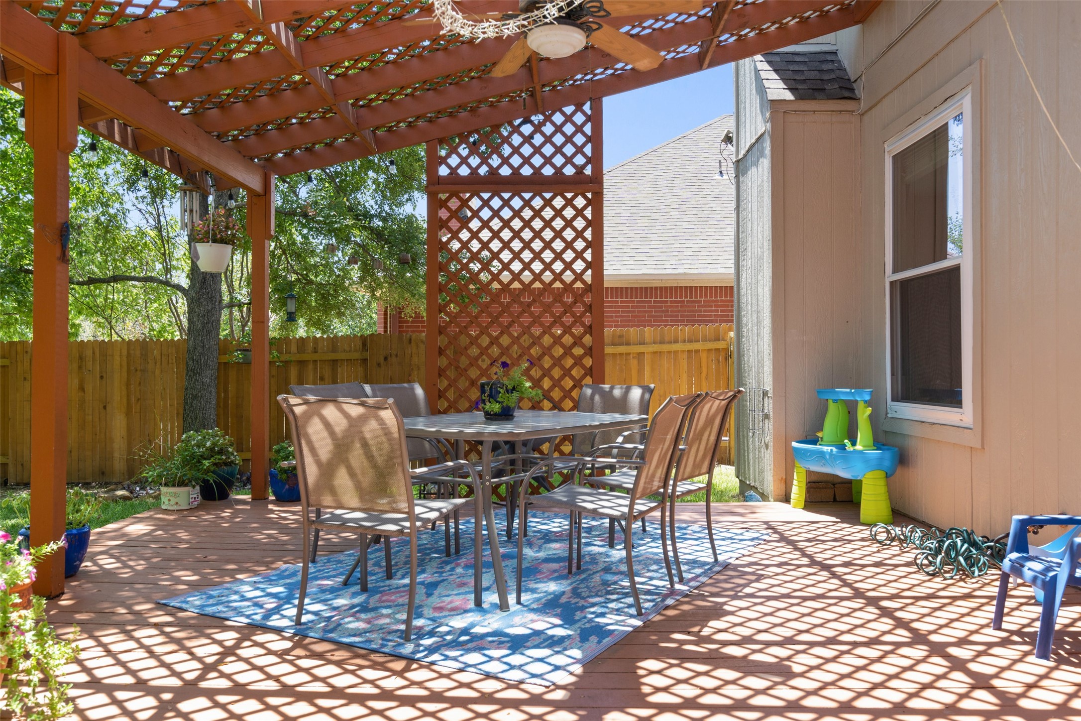12813 Withers Way Austin, TX 78727 - Photo 29 of 40 a view of a dining table and chairs in patio