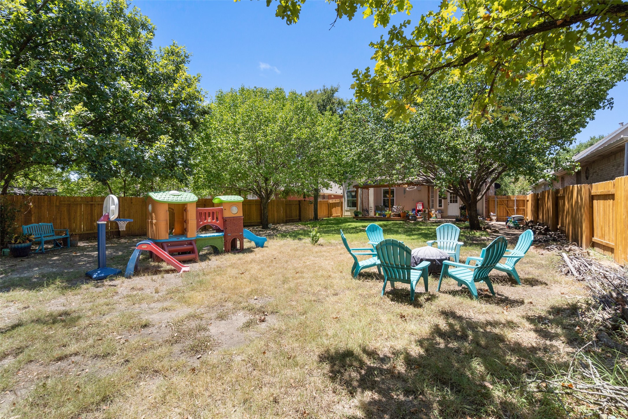 12813 Withers Way Austin, TX 78727 - Photo 31 of 40 a view of a backyard with a sitting area and furniture