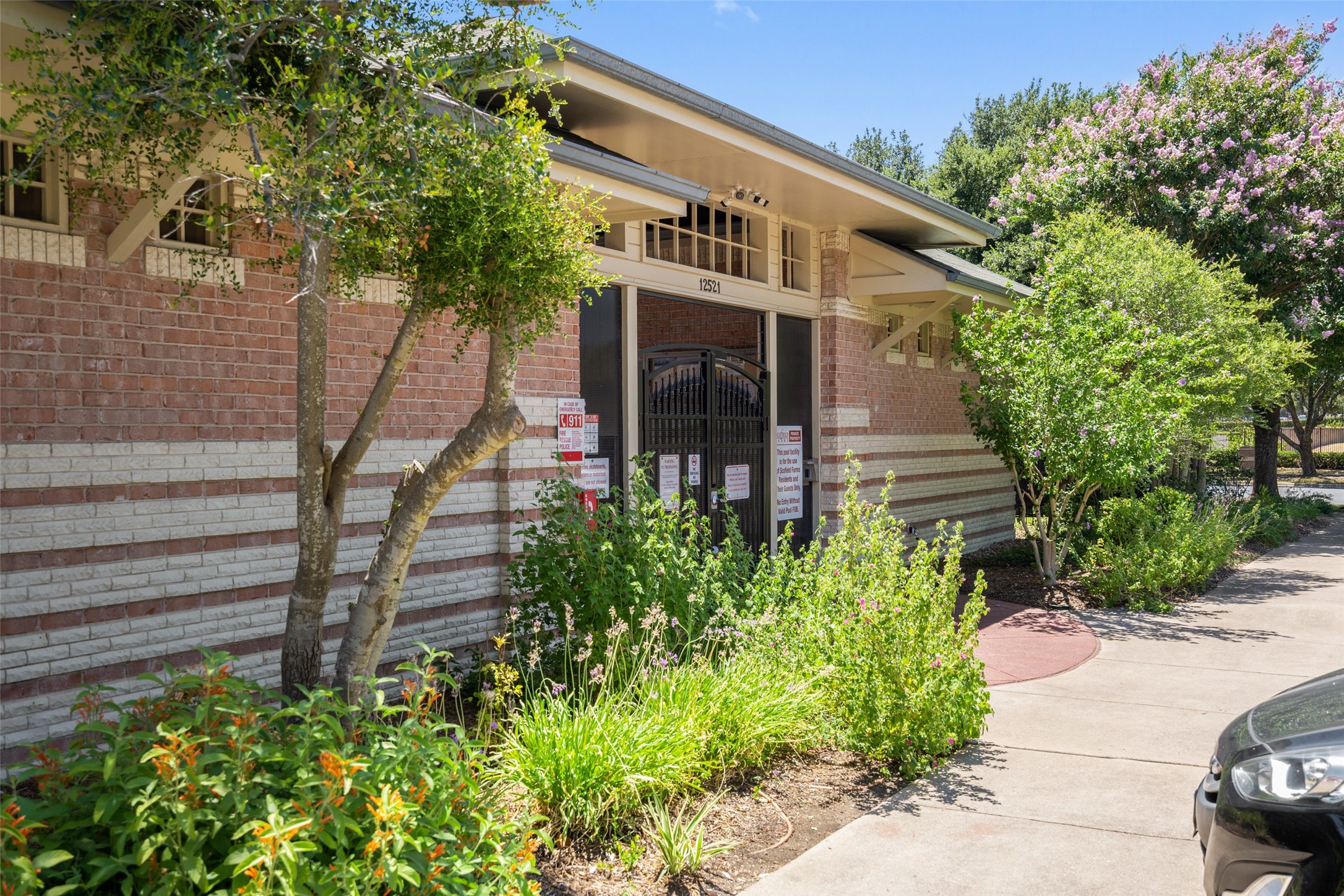 12813 Withers Way Austin, TX 78727 - Photo 40 of 40 a front view of a house with a yard