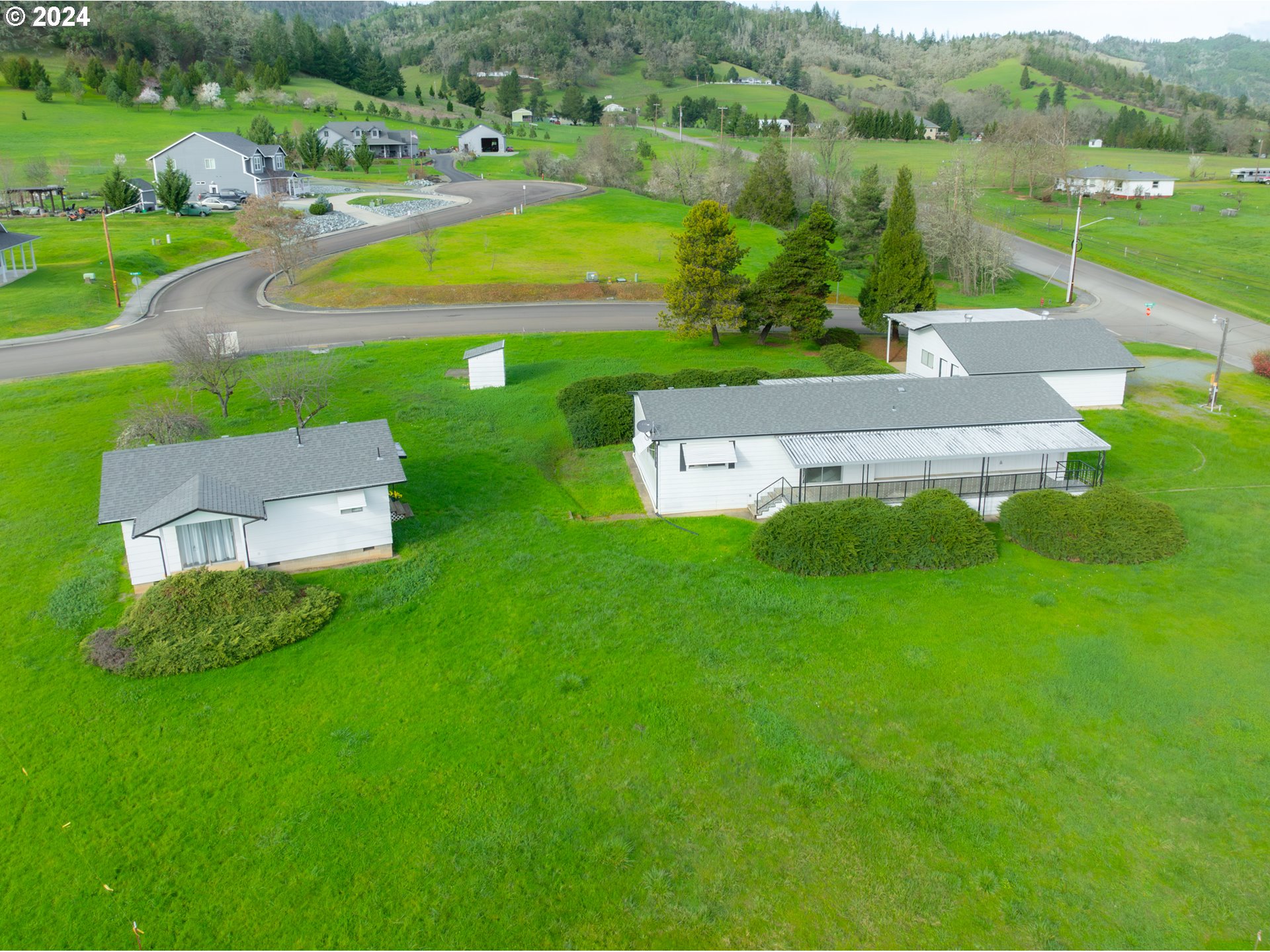 a view of a house with a big yard