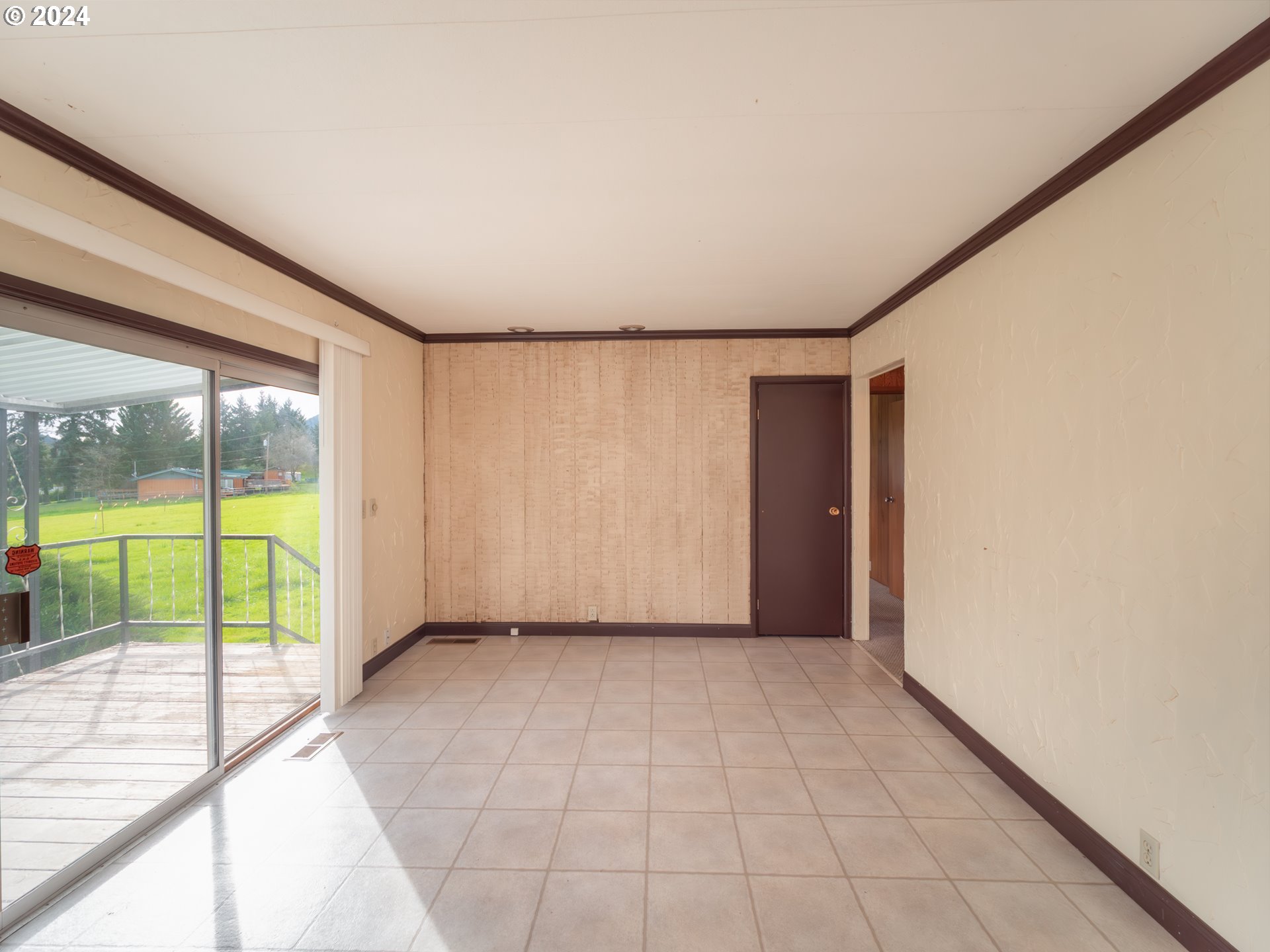 150 Spring Brook Road Myrtle Creek, OR 97457 - Photo 11 of 42 a view of an empty room with a window