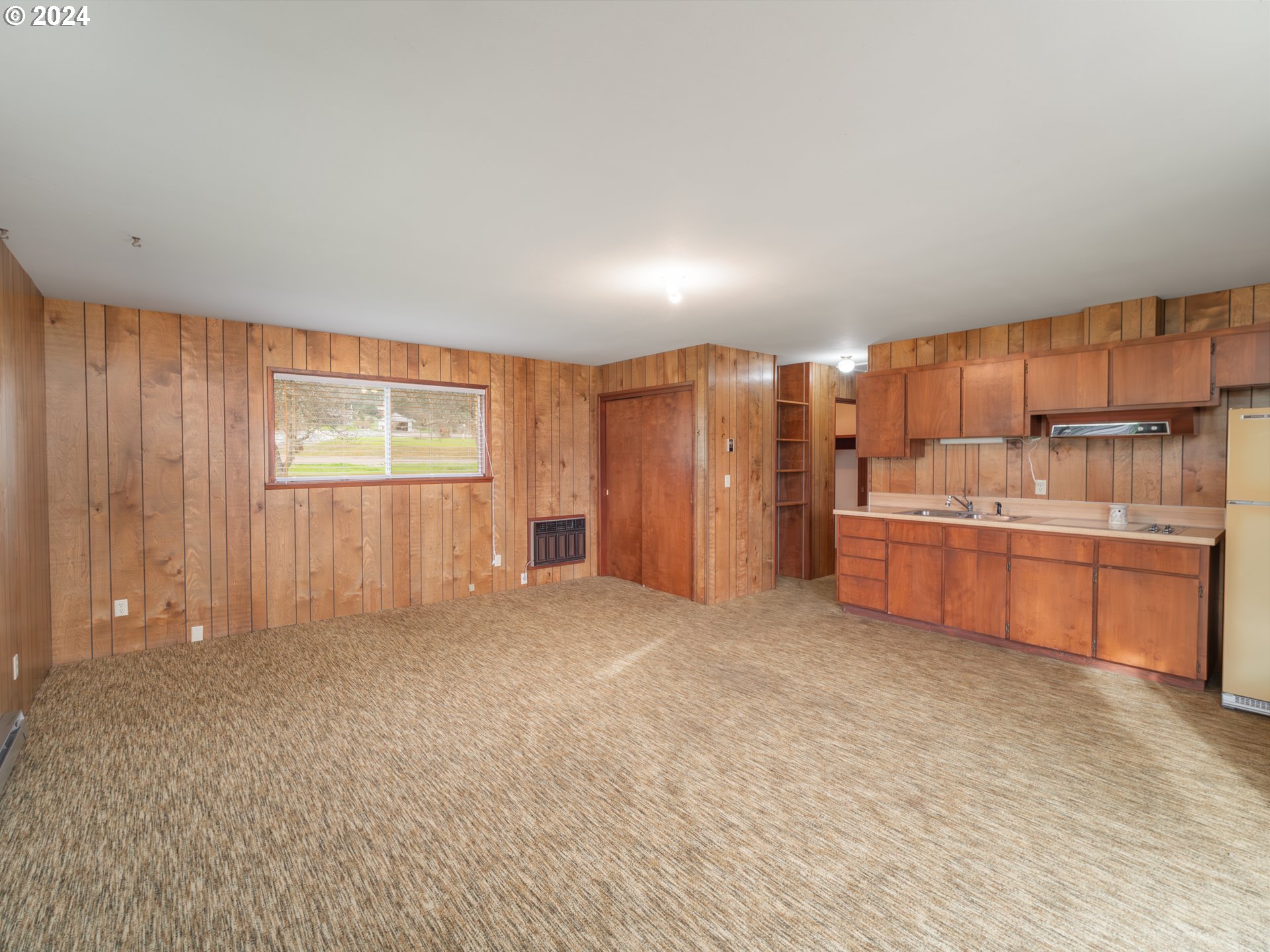 150 Spring Brook Road Myrtle Creek, OR 97457 - Photo 24 of 42 a view of a kitchen with refrigerator and cabinets