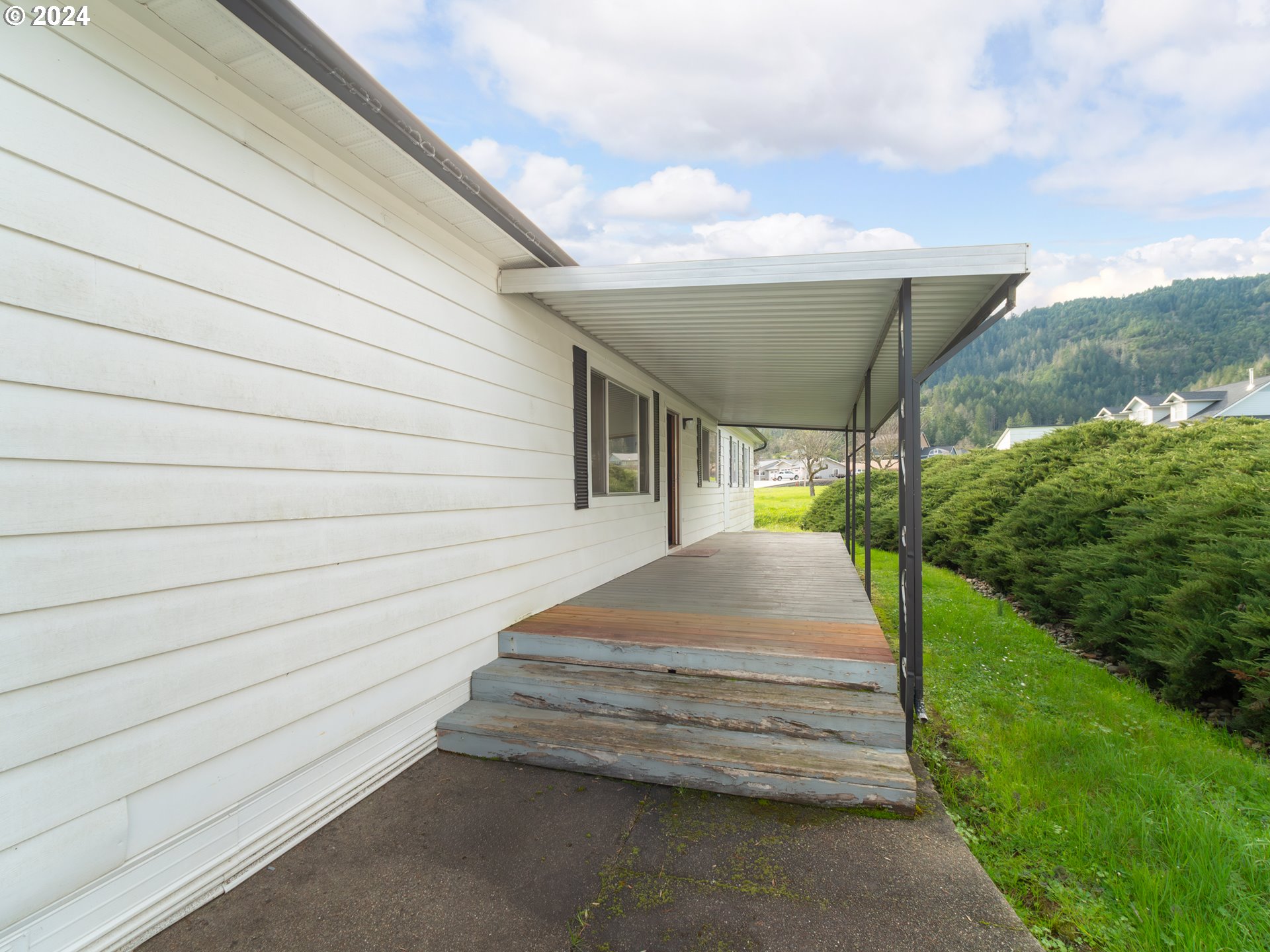 150 Spring Brook Road Myrtle Creek, OR 97457 - Photo 5 of 42 a yellow house with outdoor space
