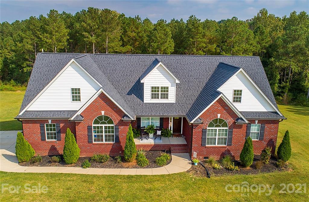 5813 Dudley Road Monroe, NC 28112 - Photo 1 of 44 a front view of a house with a yard