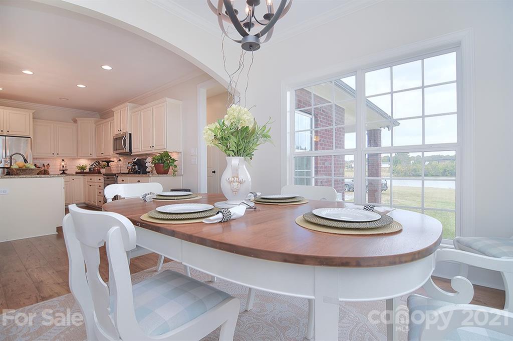 5813 Dudley Road Monroe, NC 28112 - Photo 14 of 44 a kitchen with a table and chairs