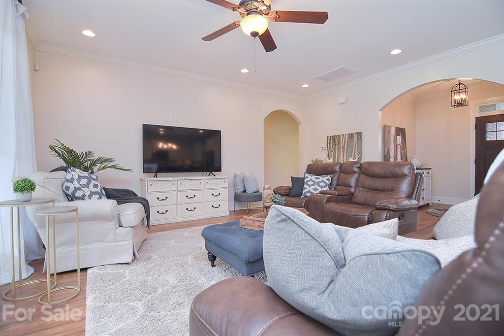 5813 Dudley Road Monroe, NC 28112 - Photo 17 of 44 a living room with furniture and a flat screen tv