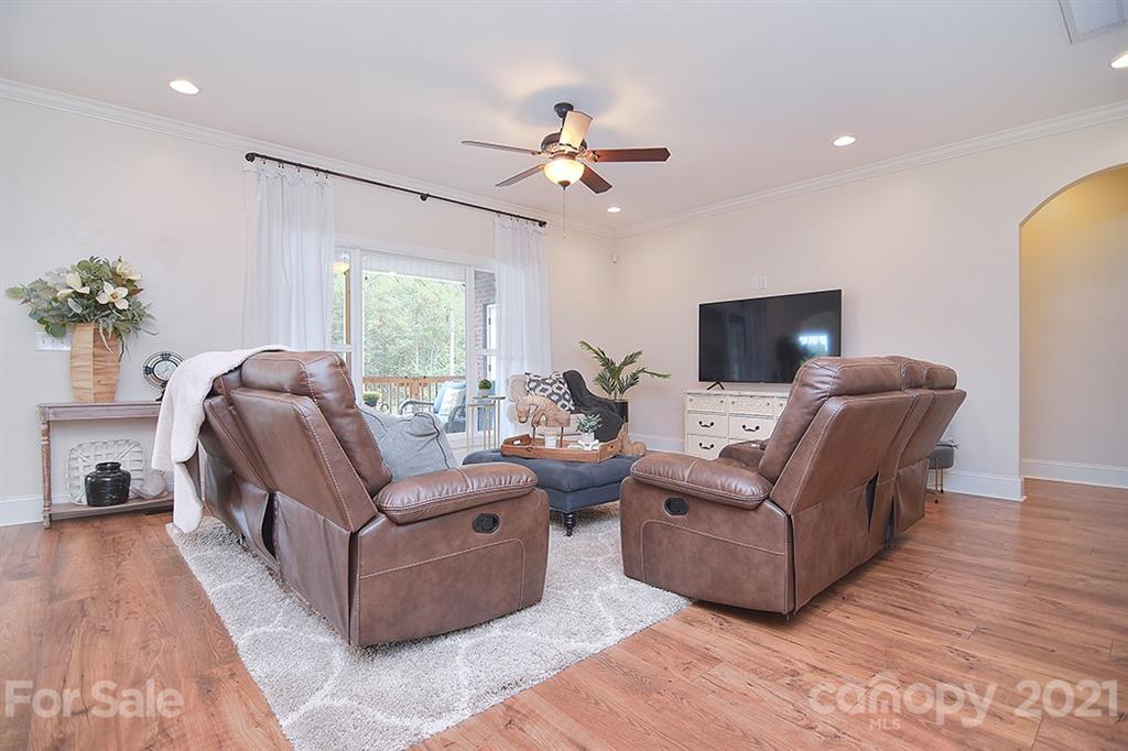 5813 Dudley Road Monroe, NC 28112 - Photo 18 of 44 a living room with furniture and a chandelier