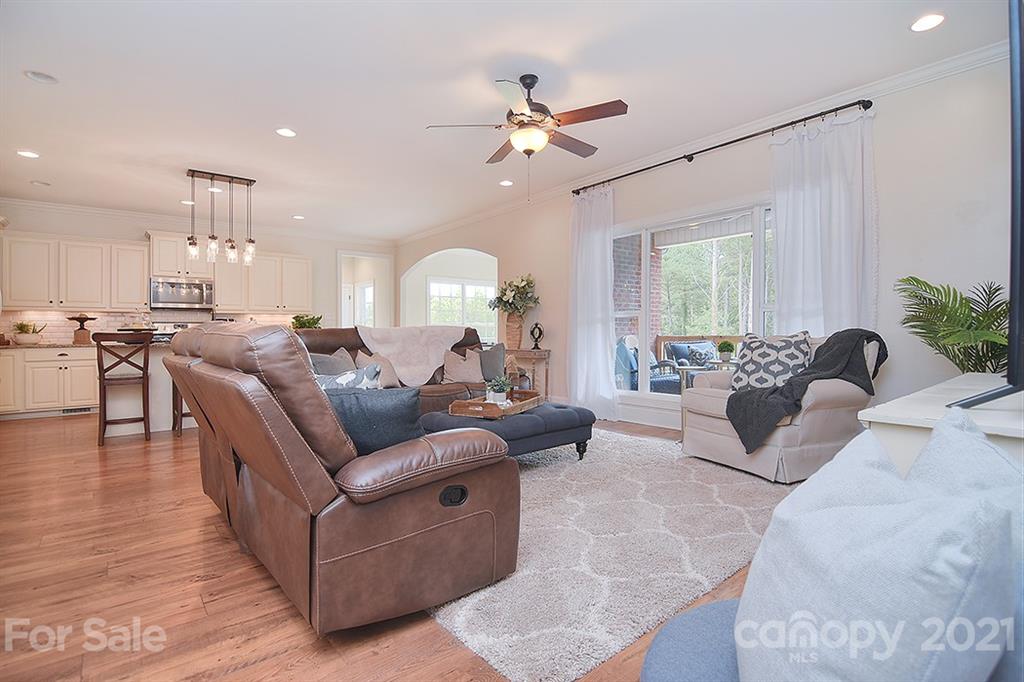5813 Dudley Road Monroe, NC 28112 - Photo 19 of 44 a living room with furniture kitchen view and a large window