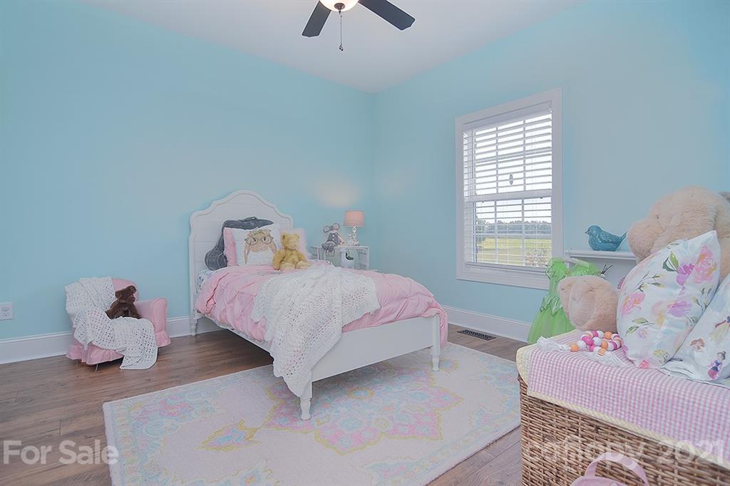 5813 Dudley Road Monroe, NC 28112 - Photo 30 of 44 a bedroom with a bed and a window