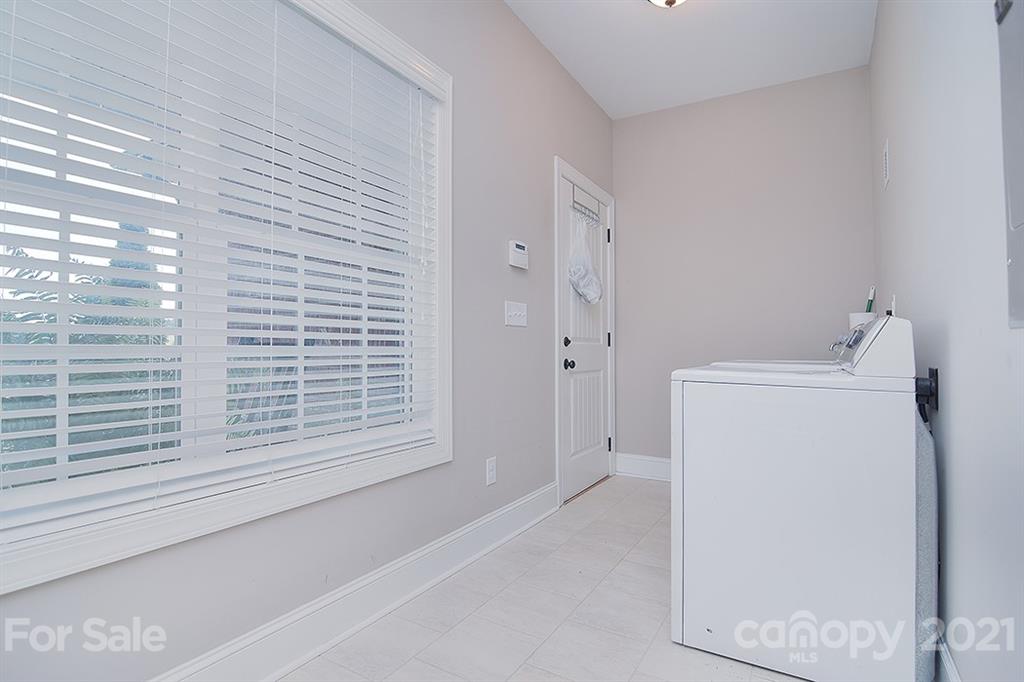 5813 Dudley Road Monroe, NC 28112 - Photo 32 of 44 a bathroom with a bathtub and a window