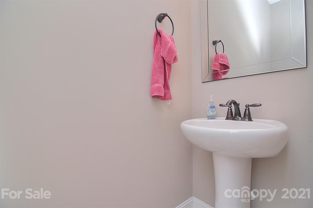 5813 Dudley Road Monroe, NC 28112 - Photo 33 of 44 a bathroom with a sink and mirror