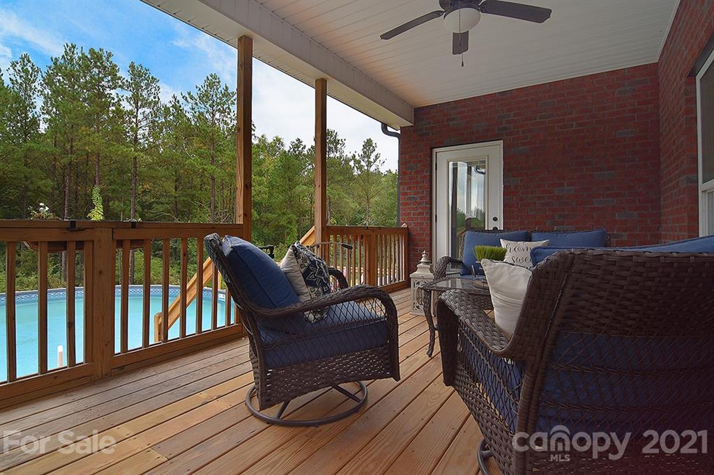 5813 Dudley Road Monroe, NC 28112 - Photo 34 of 44 a view of balcony with couch and wooden floor