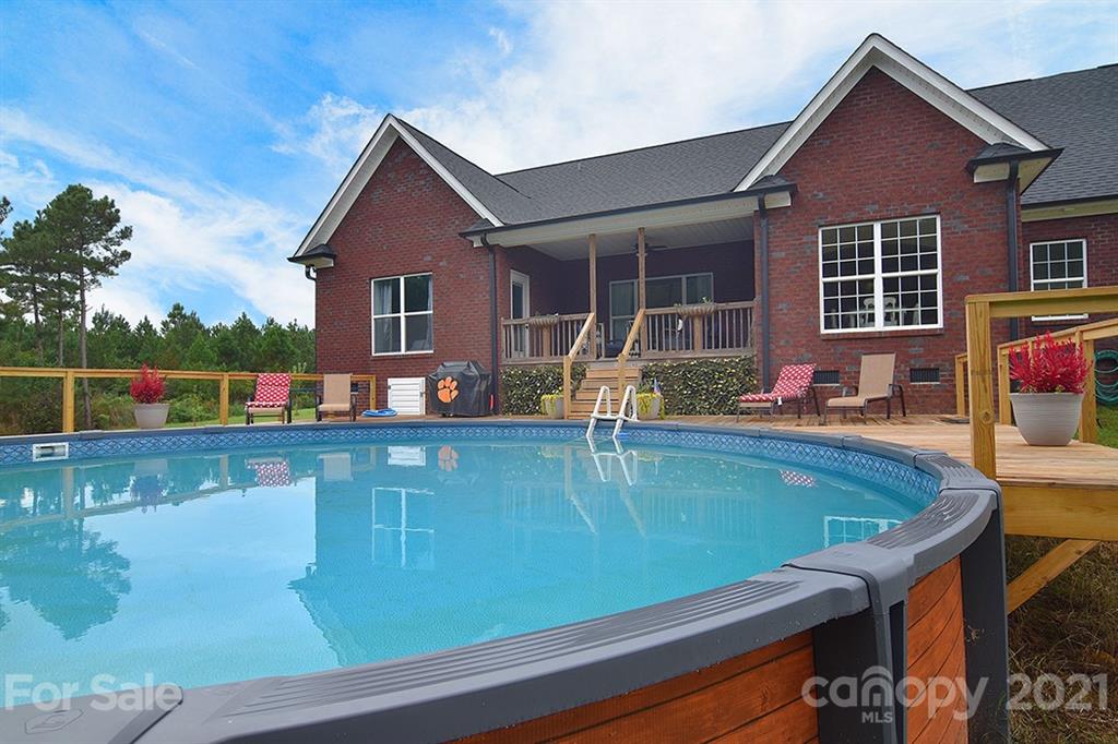 5813 Dudley Road Monroe, NC 28112 - Photo 39 of 44 a view of a house with a swimming pool