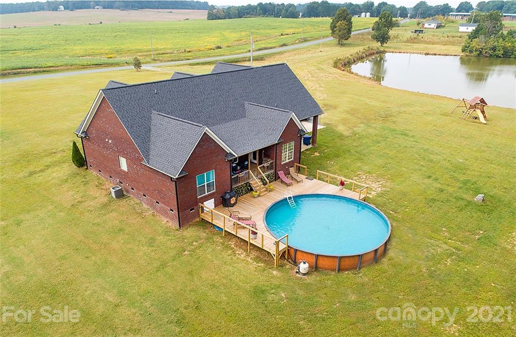 5813 Dudley Road Monroe, NC 28112 - Photo 4 of 44 a view of a swimming pool with an ocean view