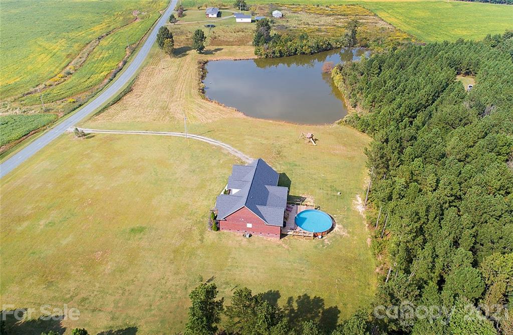 5813 Dudley Road Monroe, NC 28112 - Photo 5 of 44 an aerial view of residential houses with outdoor space