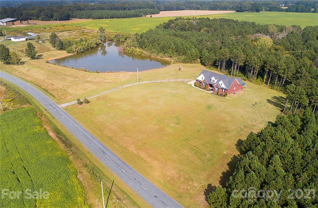 5813 Dudley Road Monroe, NC 28112 - Photo 6 of 44 a view of a swimming pool with a yard