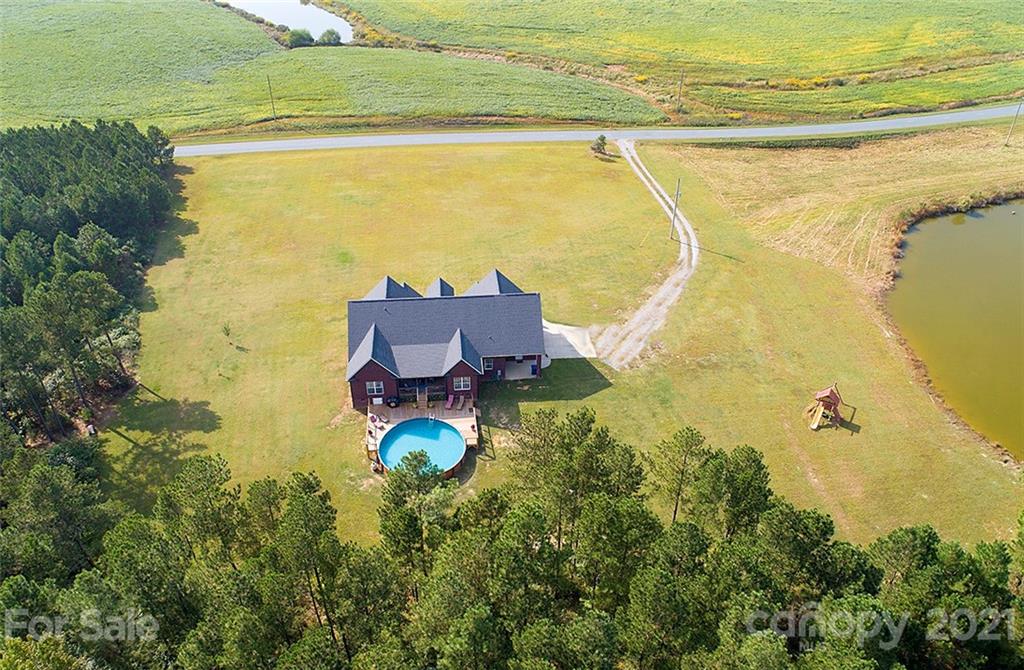 5813 Dudley Road Monroe, NC 28112 - Photo 7 of 44 a view of a swimming pool with an ocean view