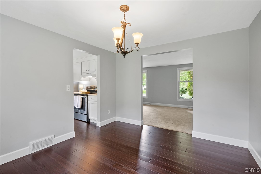 8841 Wandering Way Lysander, NY 13027 - Photo 9 of 42 Gorgeous Stranded Bamboo Flooring in Dining Room, Kitchen & Hallway.