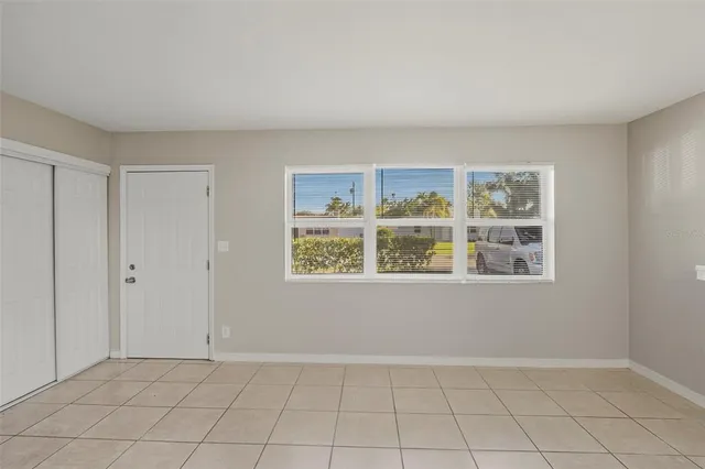 a view of an empty room with a window