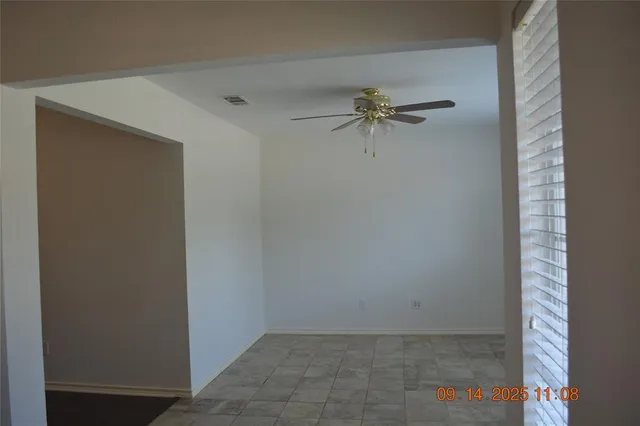 a view of an empty room and fire place