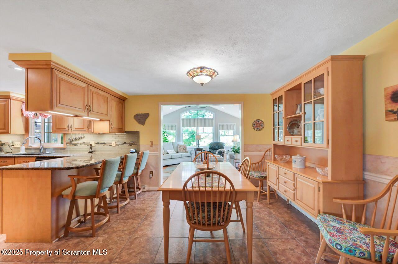 1020 Sleepy Hollow Road Clarks Summit, PA 18411 - Photo 11 of 62 a view of a dining room with furniture window and outside view