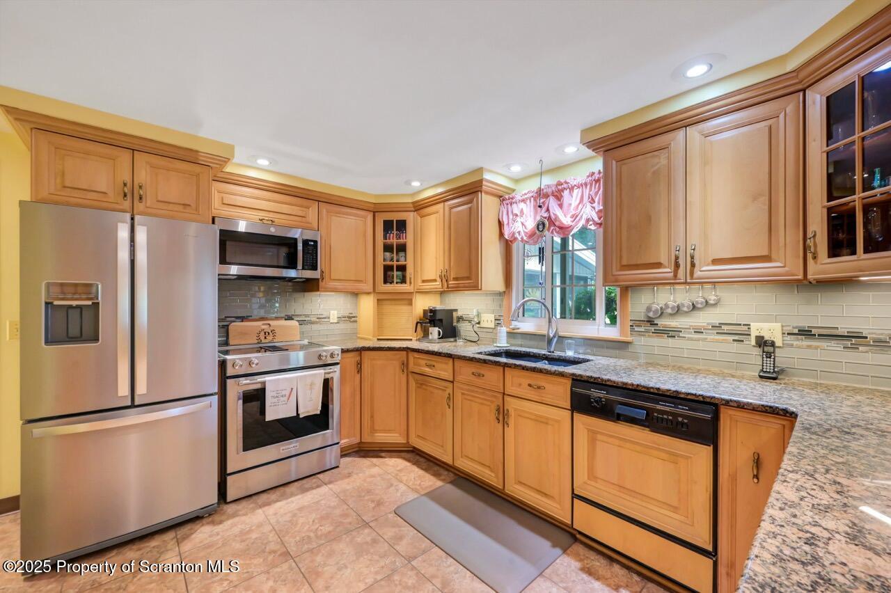 1020 Sleepy Hollow Road Clarks Summit, PA 18411 - Photo 15 of 62 a kitchen with stainless steel appliances granite countertop a refrigerator sink and stove