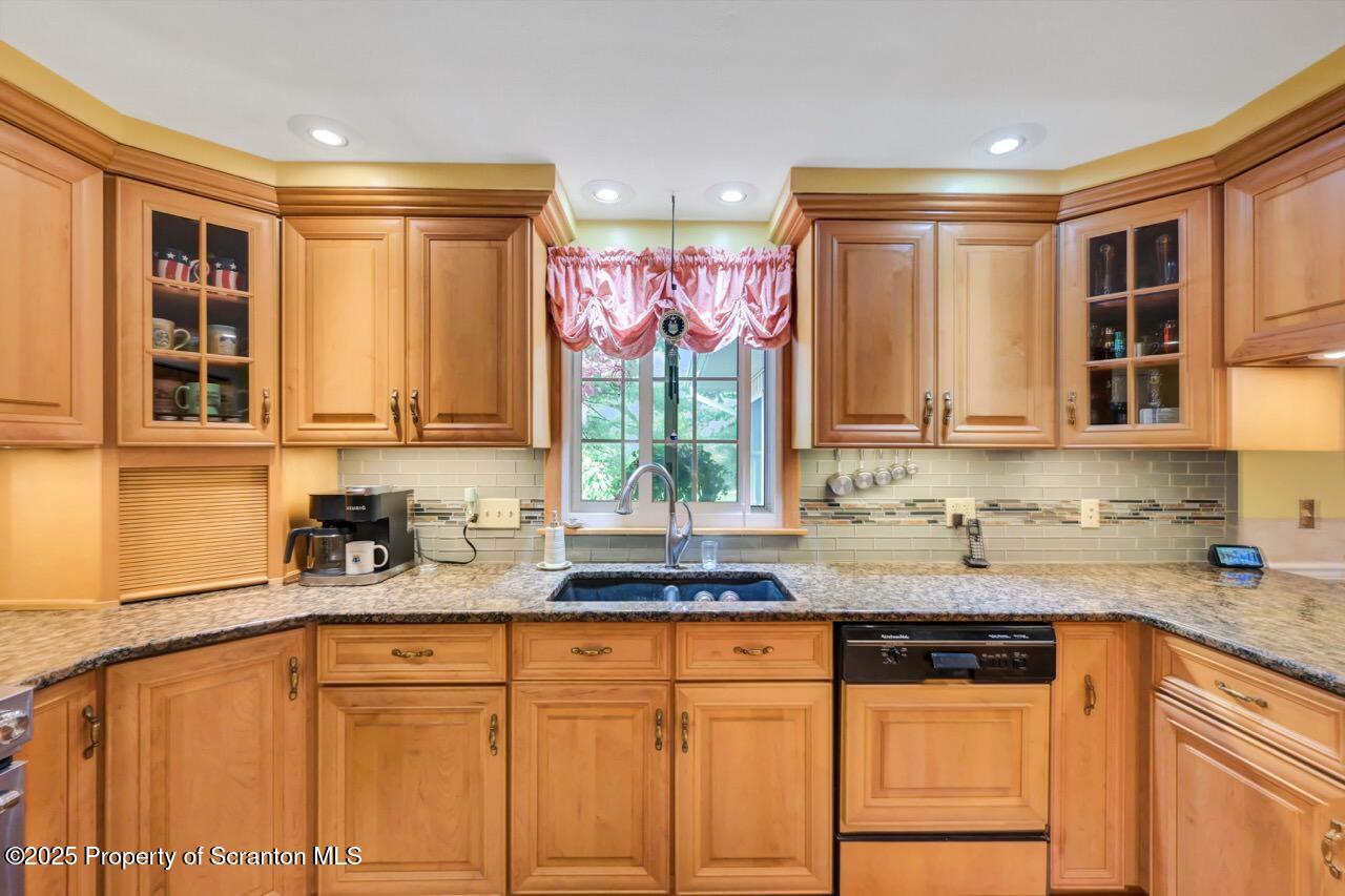 1020 Sleepy Hollow Road Clarks Summit, PA 18411 - Photo 16 of 62 a kitchen with stainless steel appliances granite countertop a sink and a window