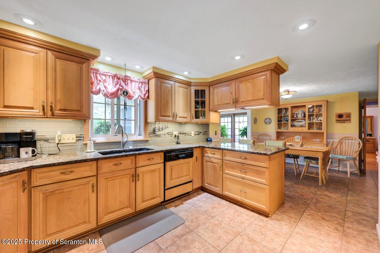 1020 Sleepy Hollow Road Clarks Summit, PA 18411 - Photo 17 of 62 a kitchen with granite countertop lots of white cabinets a sink and dishwasher