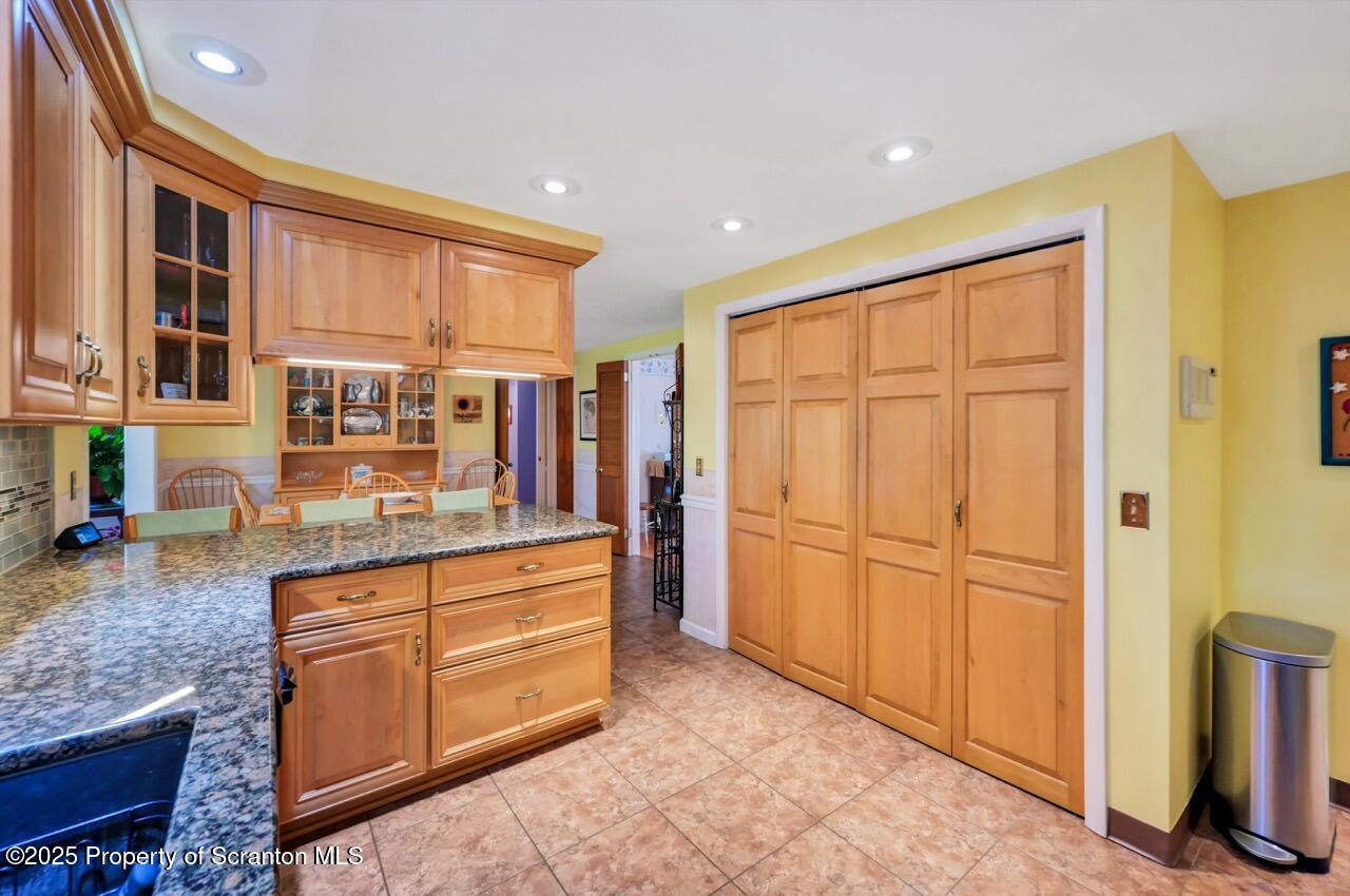 1020 Sleepy Hollow Road Clarks Summit, PA 18411 - Photo 18 of 62 a kitchen with stainless steel appliances granite countertop a refrigerator and a stove top oven