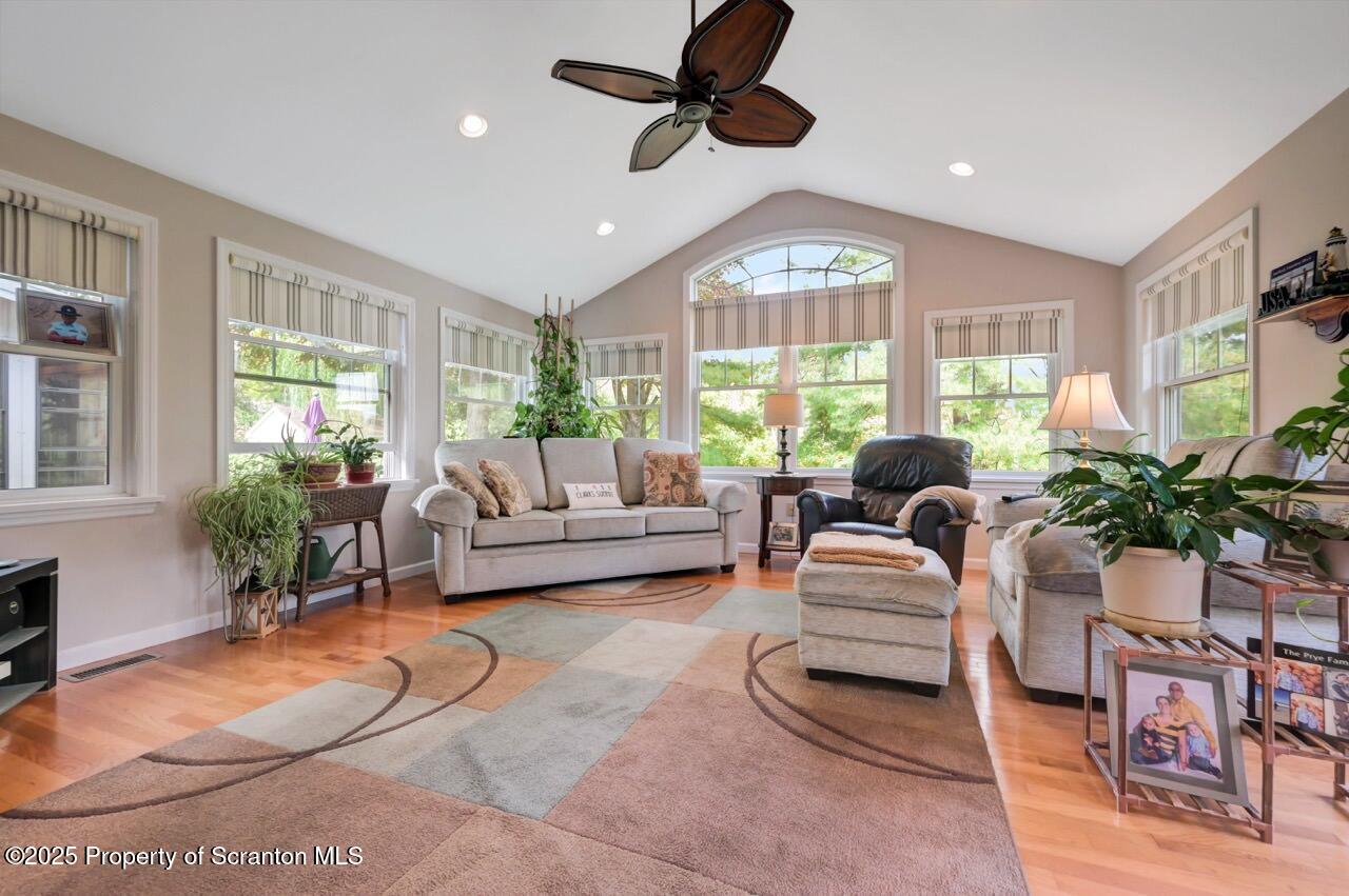 1020 Sleepy Hollow Road Clarks Summit, PA 18411 - Photo 19 of 62 a living room with furniture a chandelier and a large window
