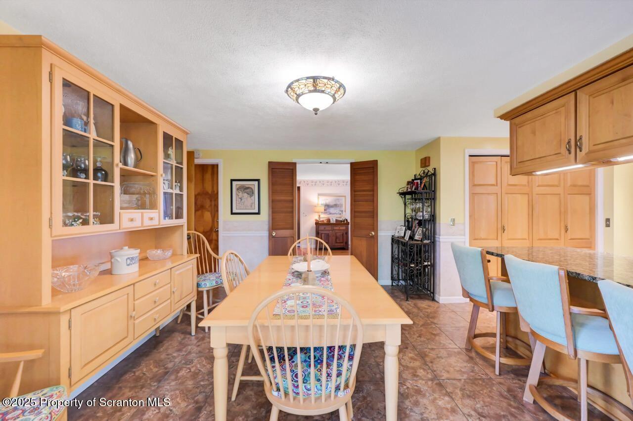1020 Sleepy Hollow Road Clarks Summit, PA 18411 - Photo 25 of 62 a view of a dining room with furniture window and wooden floor