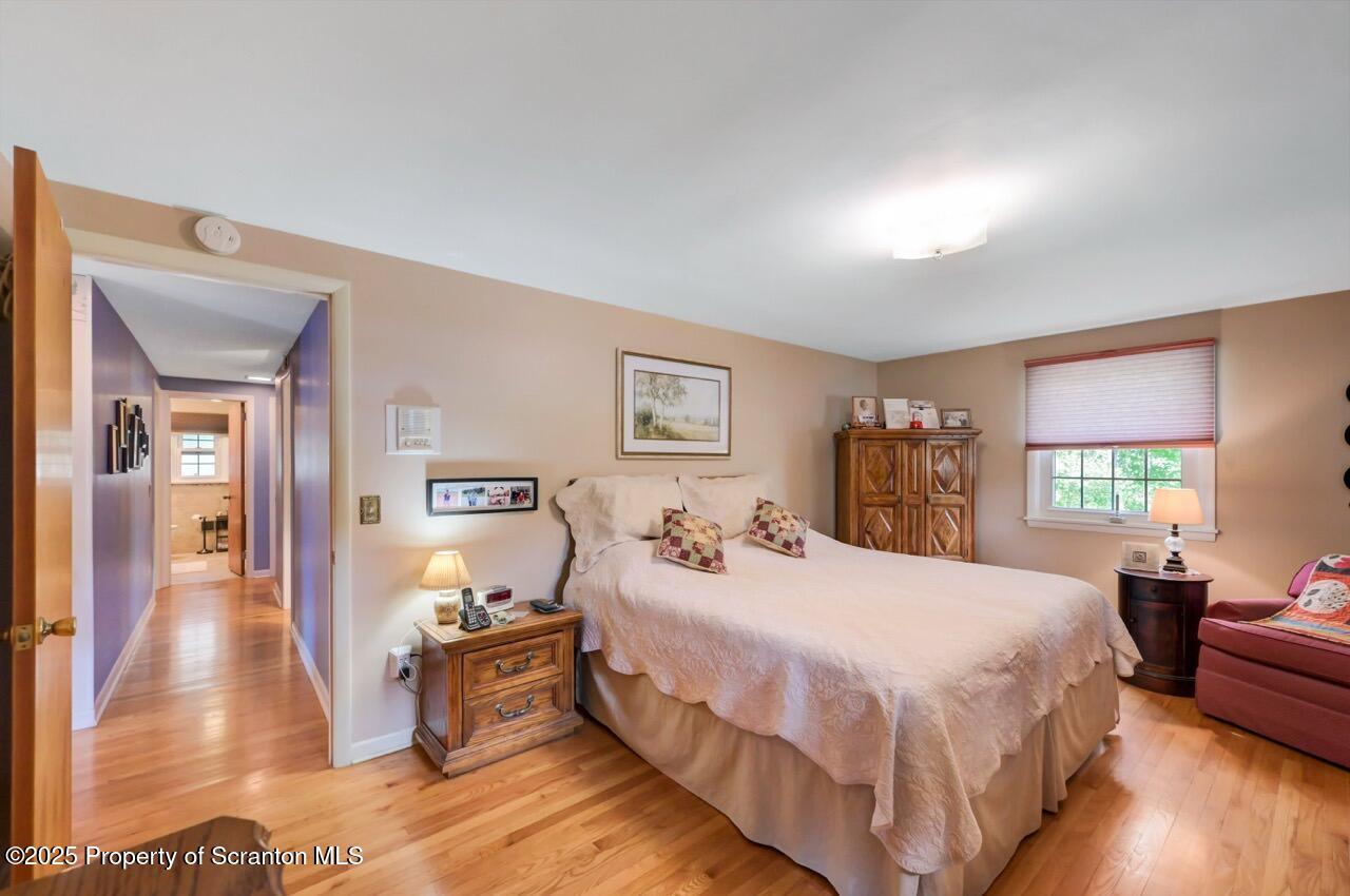 1020 Sleepy Hollow Road Clarks Summit, PA 18411 - Photo 28 of 62 a bedroom with a bed and wooden floor