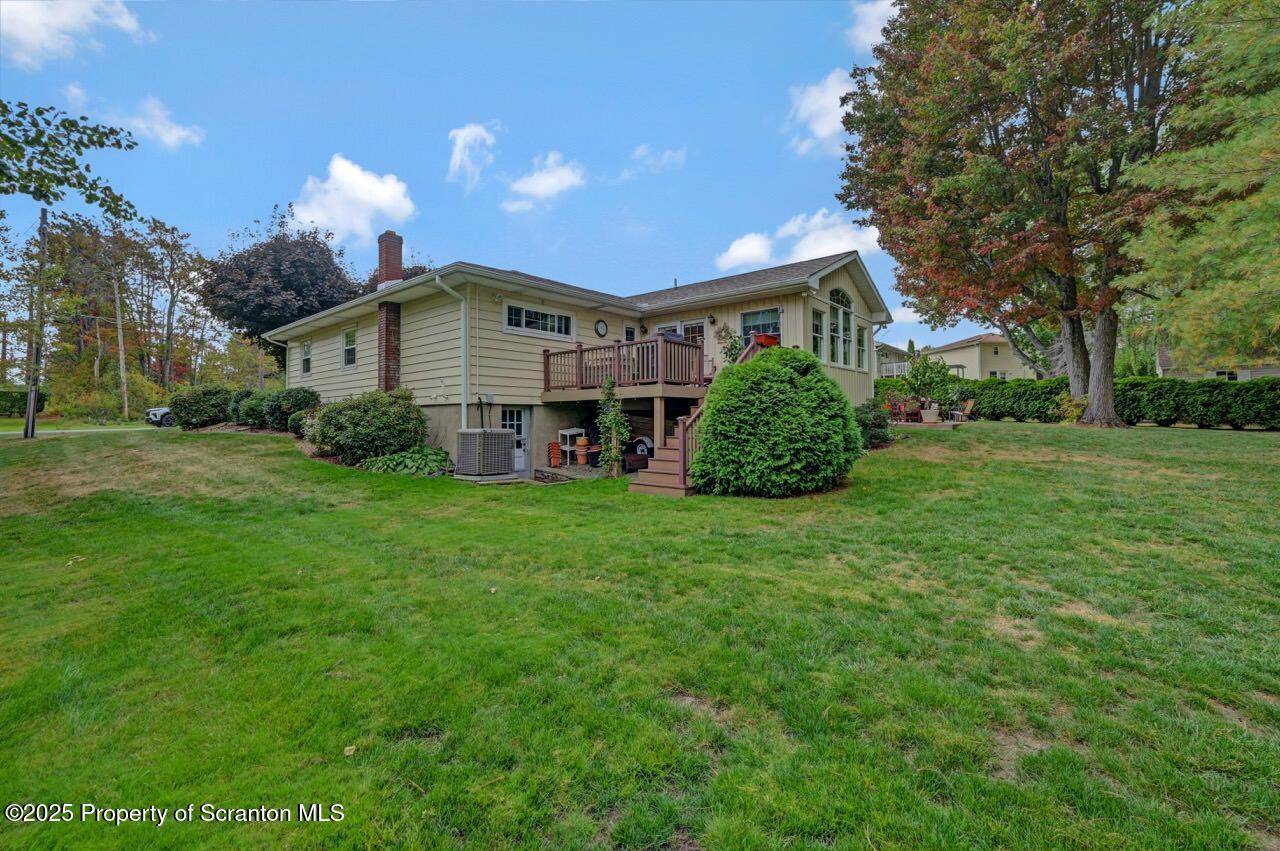 1020 Sleepy Hollow Road Clarks Summit, PA 18411 - Photo 3 of 62 a front view of a house with a garden and plants