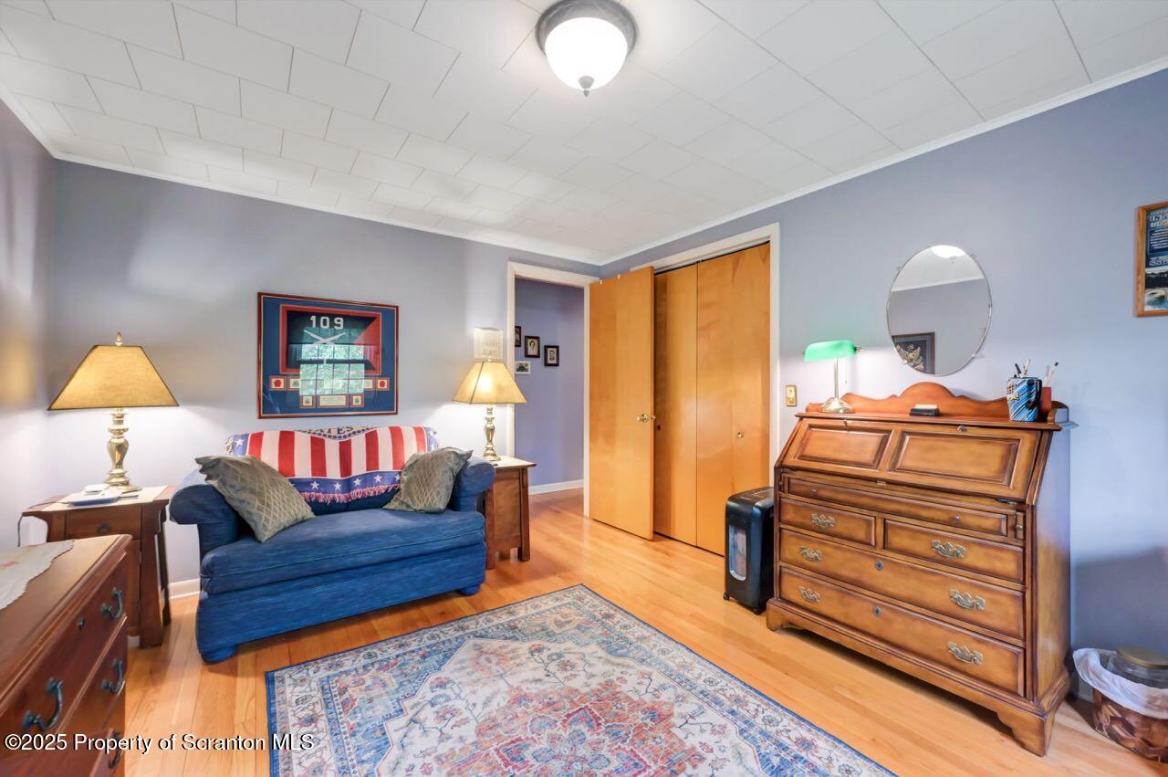 1020 Sleepy Hollow Road Clarks Summit, PA 18411 - Photo 35 of 62 a living room with furniture and a lamp