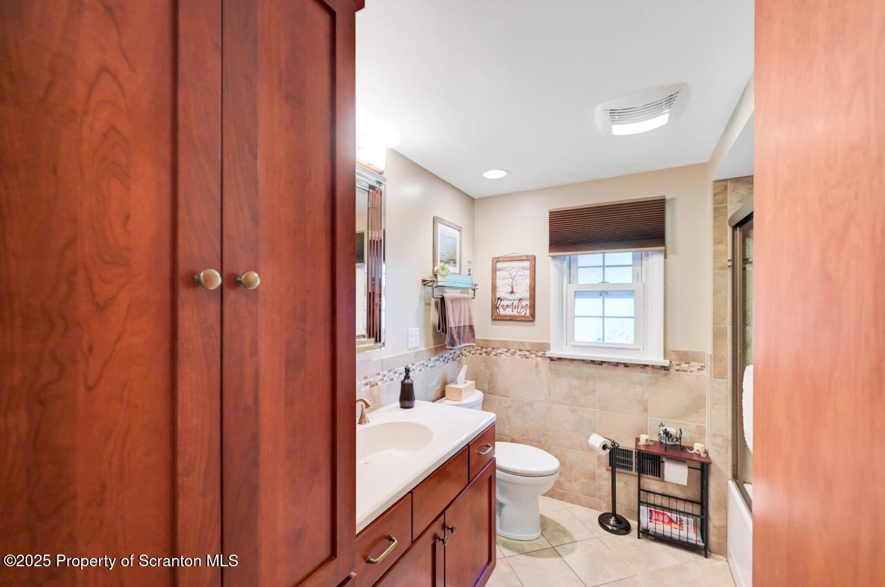 1020 Sleepy Hollow Road Clarks Summit, PA 18411 - Photo 36 of 62 a bathroom with a sink a toilet and shower