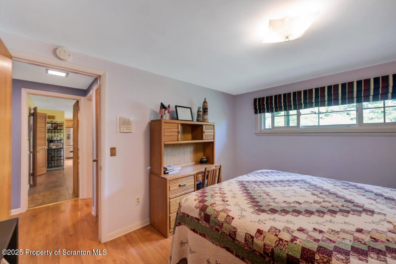 1020 Sleepy Hollow Road Clarks Summit, PA 18411 - Photo 40 of 62 a bedroom with a bed and a view of kitchen