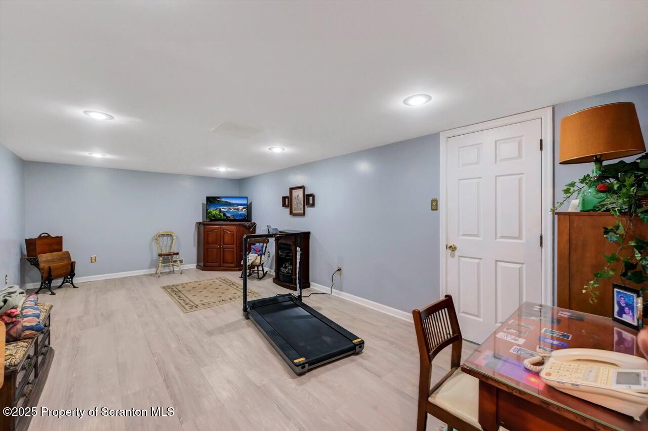 1020 Sleepy Hollow Road Clarks Summit, PA 18411 - Photo 44 of 62 a room with furniture and a flat screen tv