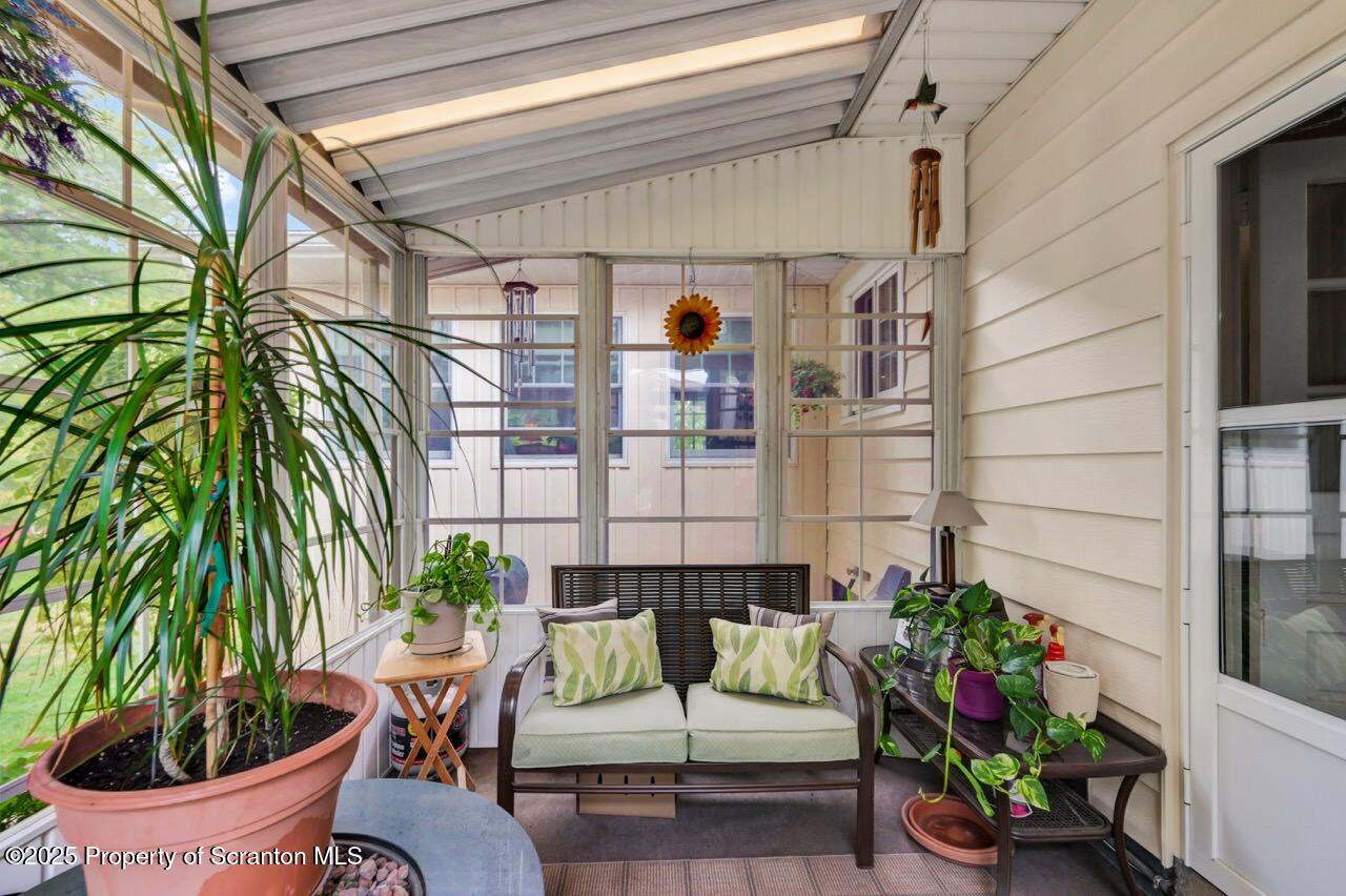 1020 Sleepy Hollow Road Clarks Summit, PA 18411 - Photo 49 of 62 a living room filled with furniture and flowers