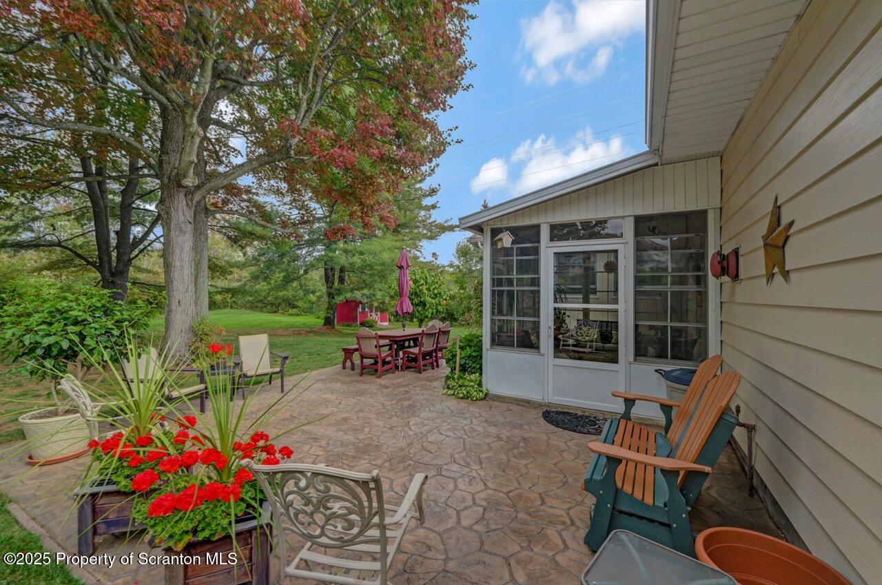1020 Sleepy Hollow Road Clarks Summit, PA 18411 - Photo 56 of 62 a view of a chairs and table in a back yard of the house