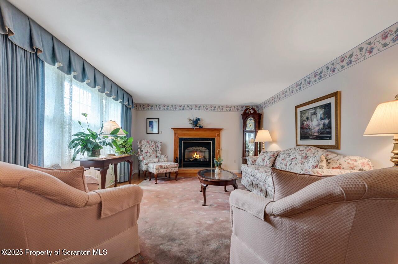 1020 Sleepy Hollow Road Clarks Summit, PA 18411 - Photo 8 of 62 a living room with furniture and a fireplace