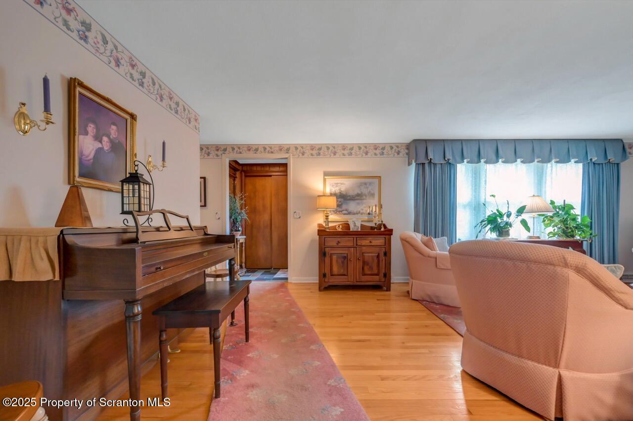 1020 Sleepy Hollow Road Clarks Summit, PA 18411 - Photo 10 of 62 a living room with furniture and a dining table