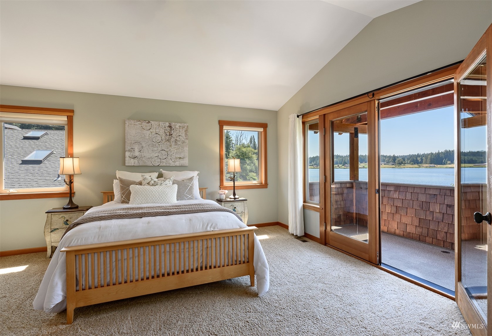 5166 Bayview Road Langley, WA 98260 - Photo 16 of 40 a bedroom with a bed and a night stand