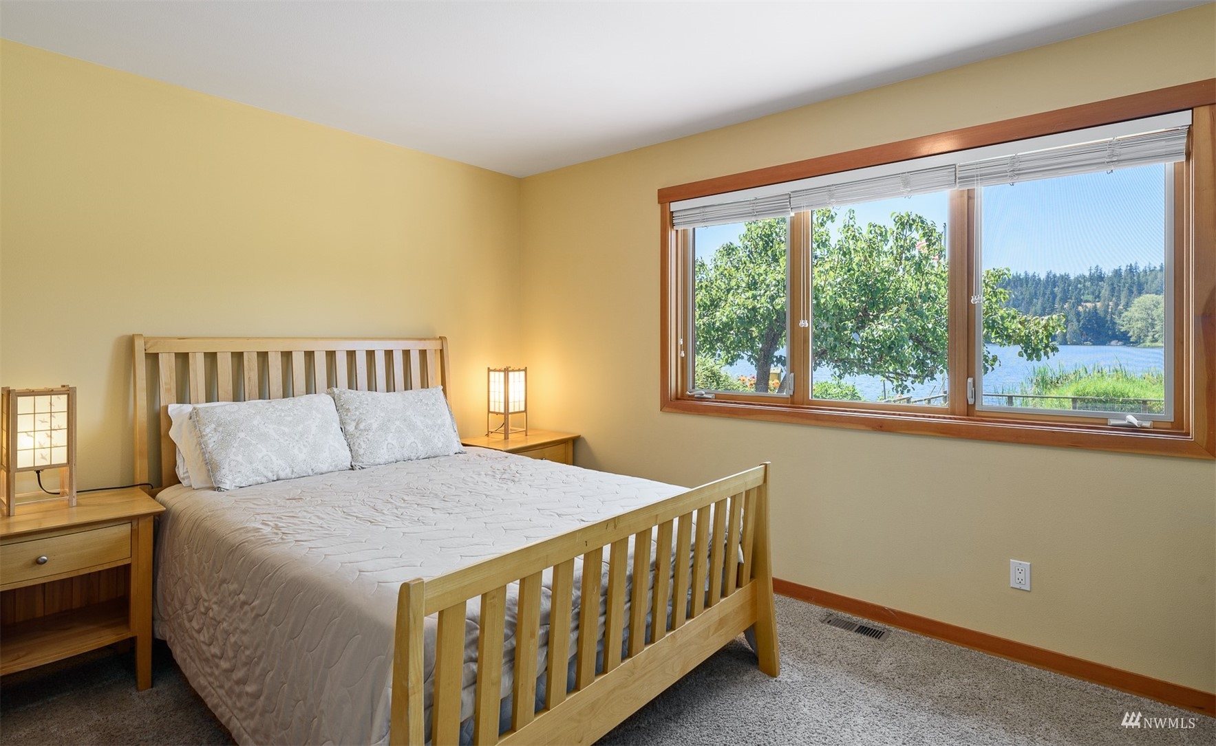 5166 Bayview Road Langley, WA 98260 - Photo 24 of 40 a bedroom with a bed and a window
