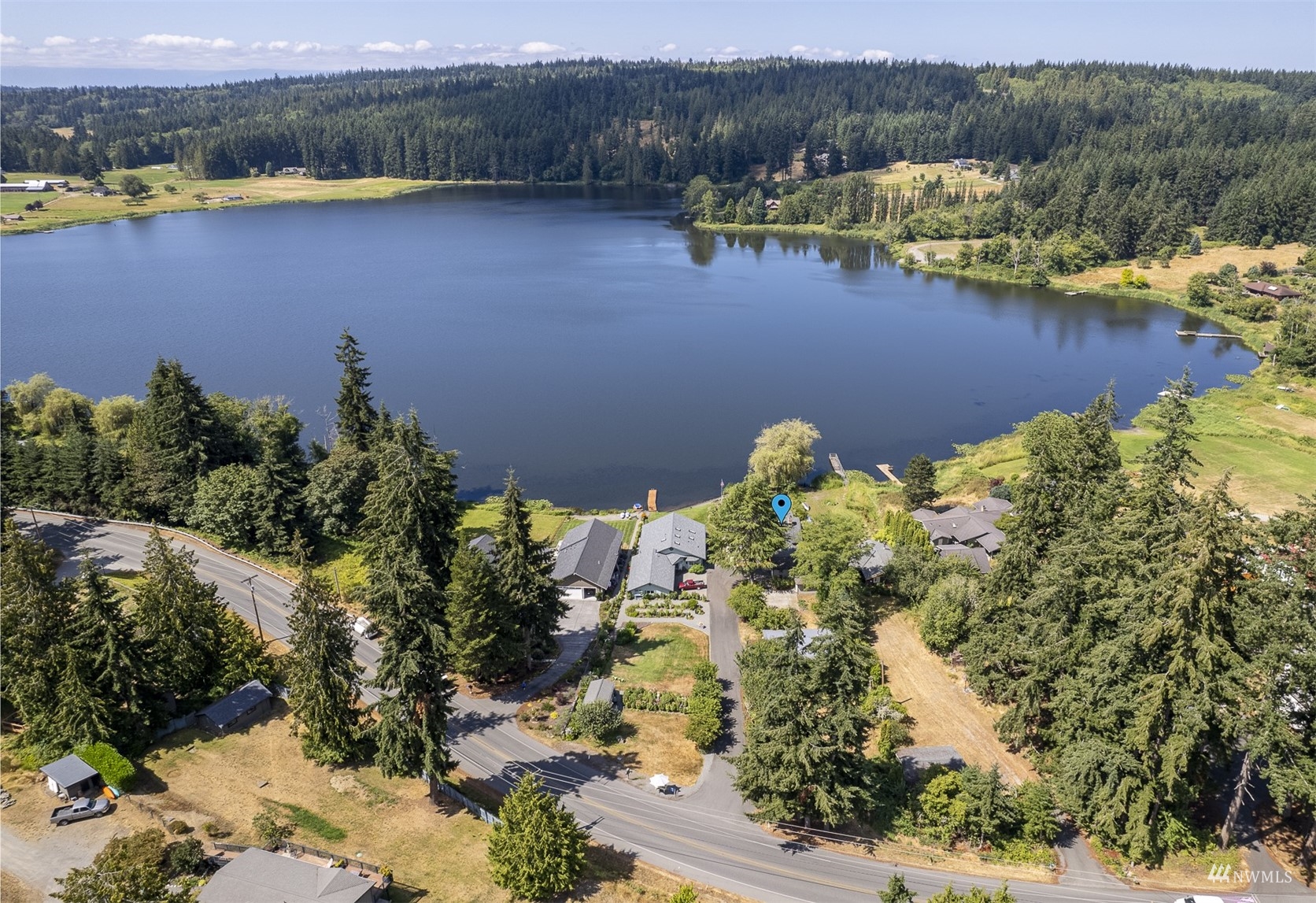 5166 Bayview Road Langley, WA 98260 - Photo 29 of 40 a view of a lake with a mountain in the background