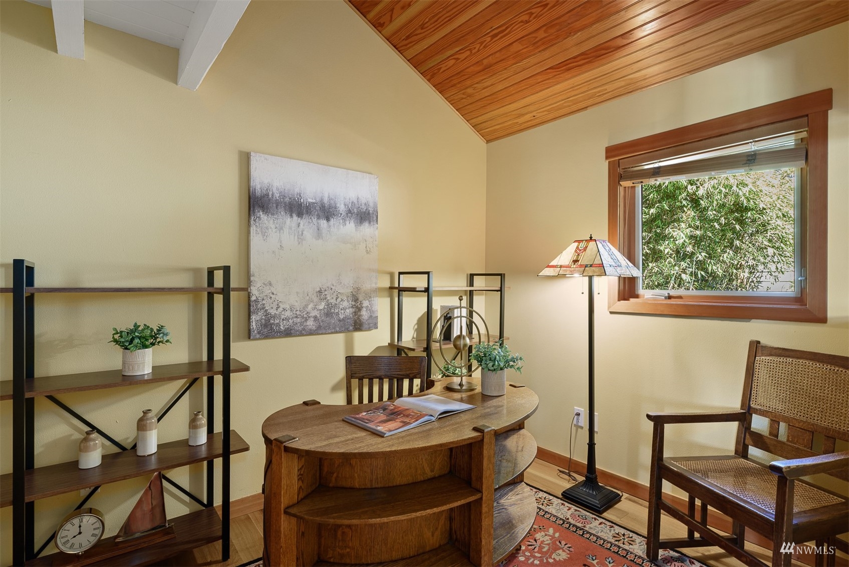 5166 Bayview Road Langley, WA 98260 - Photo 6 of 40 a view of a dining room with furniture a chandelier and wooden floor