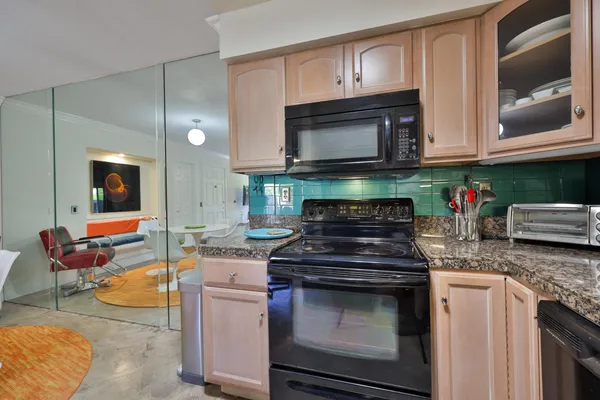 a kitchen with a refrigerator and a sink