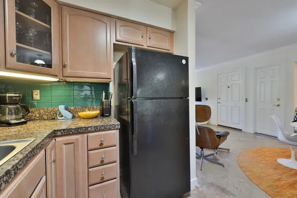 a spacious bathroom with a granite countertop double vanity sink mirror and shower
