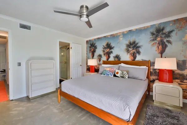 a bedroom with a bed and dresser
